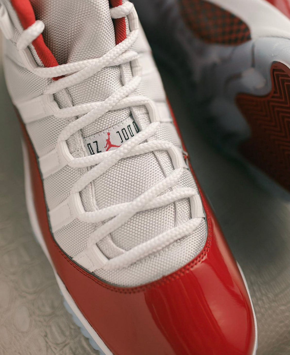 Air Jordan 11 “ Cherry / Varsity Red “