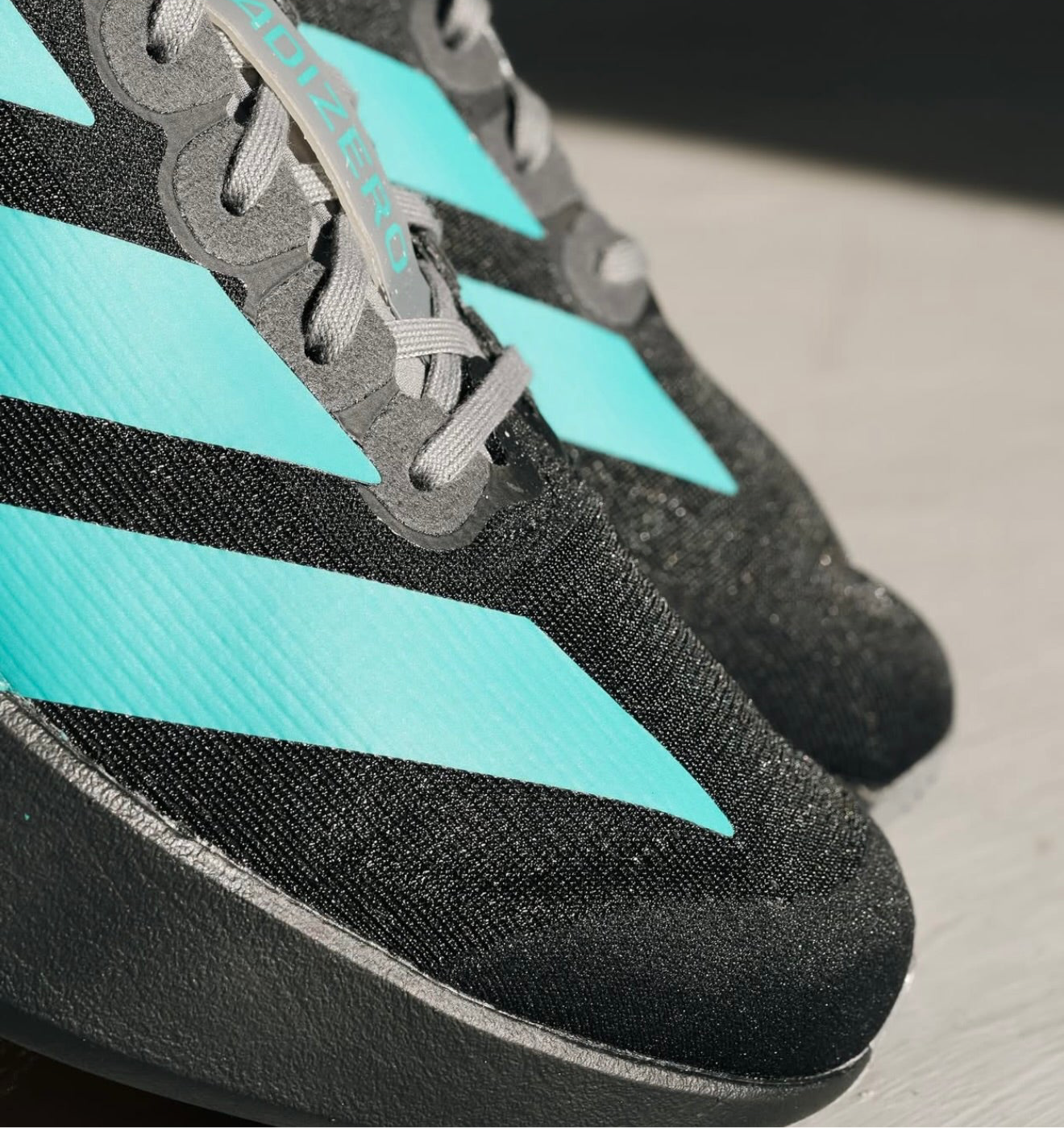 Adizero Evo SL Black Pure Teal