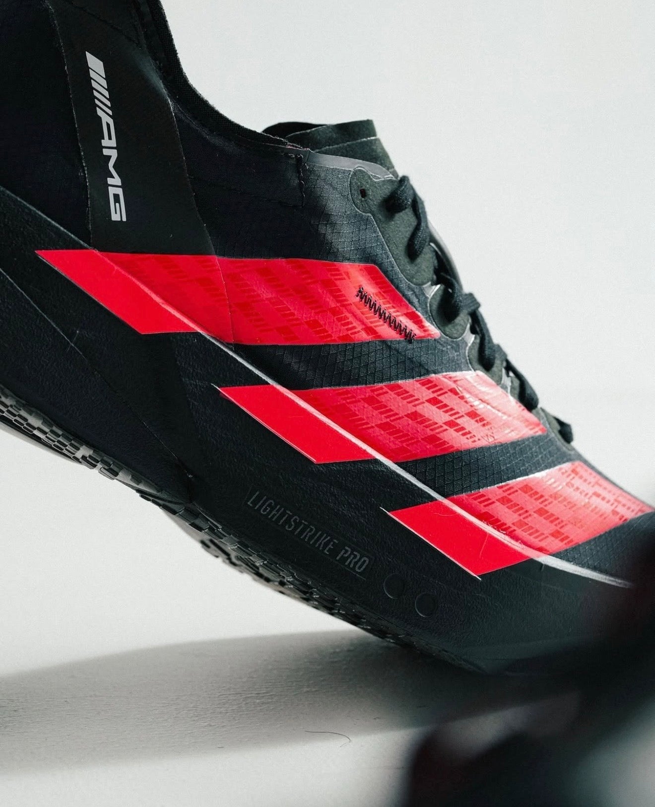 Adizero Adios Pro 4 Mercedes AMG Black Lucid Red