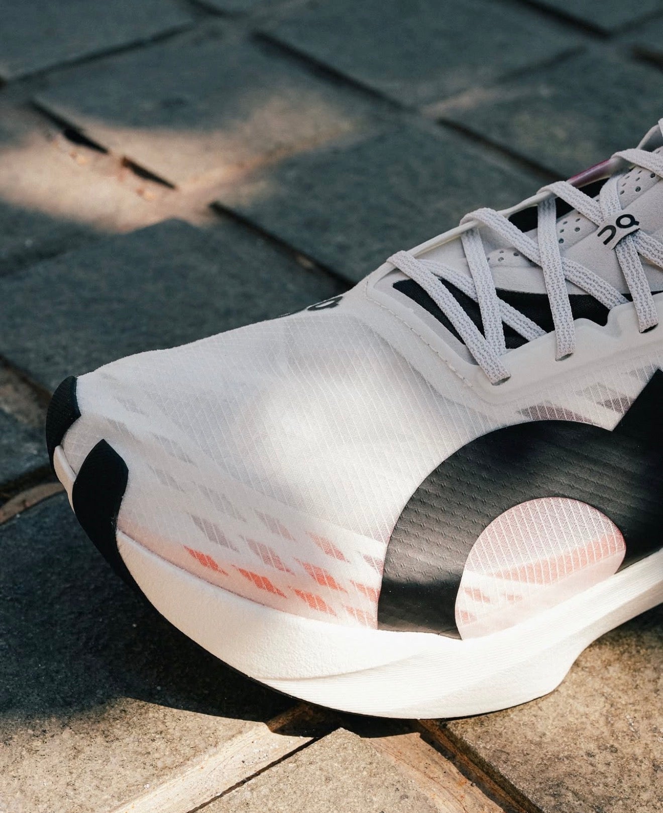 On Running Cloudboom Strike White Black Orange